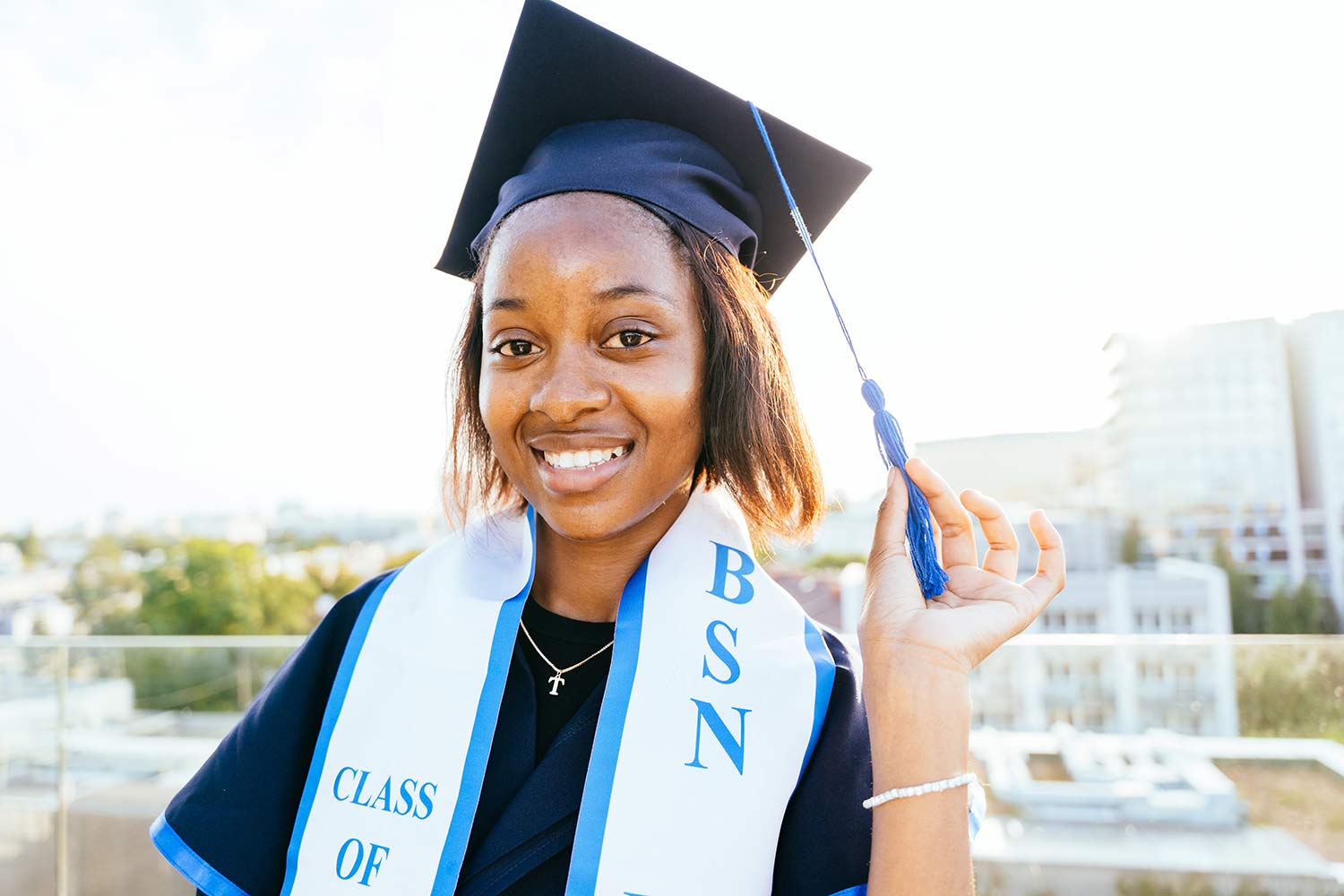 African-American BSN nursing graduate in cap and gown